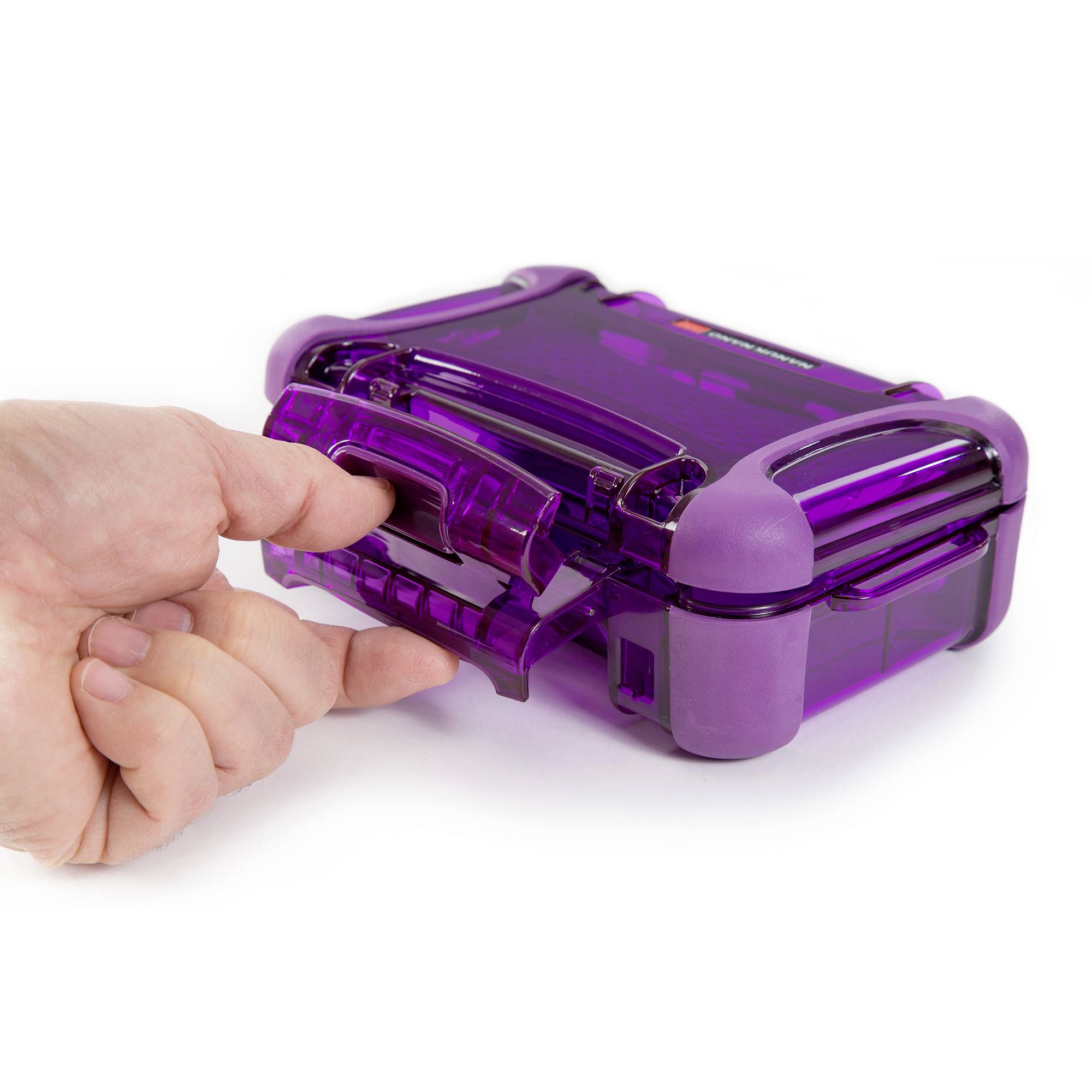 A hand opens a purple, translucent plastic container with a clip fastener.