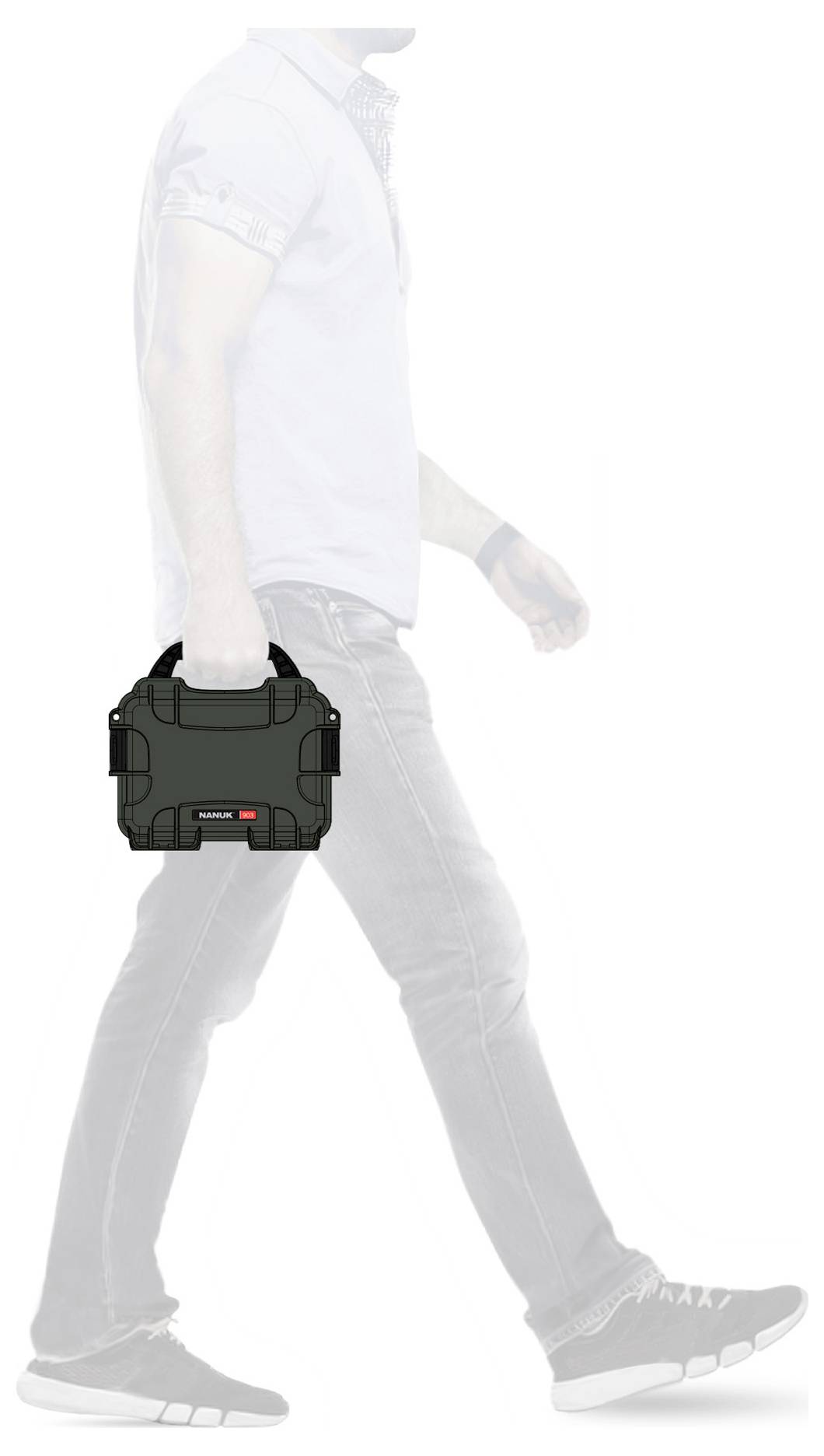 A person walks to the left, carrying a black toolbox in their right hand.