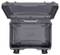An empty, grey hard-shell suitcase with an open lid. The interior reveals indentations and reinforcement ribs.