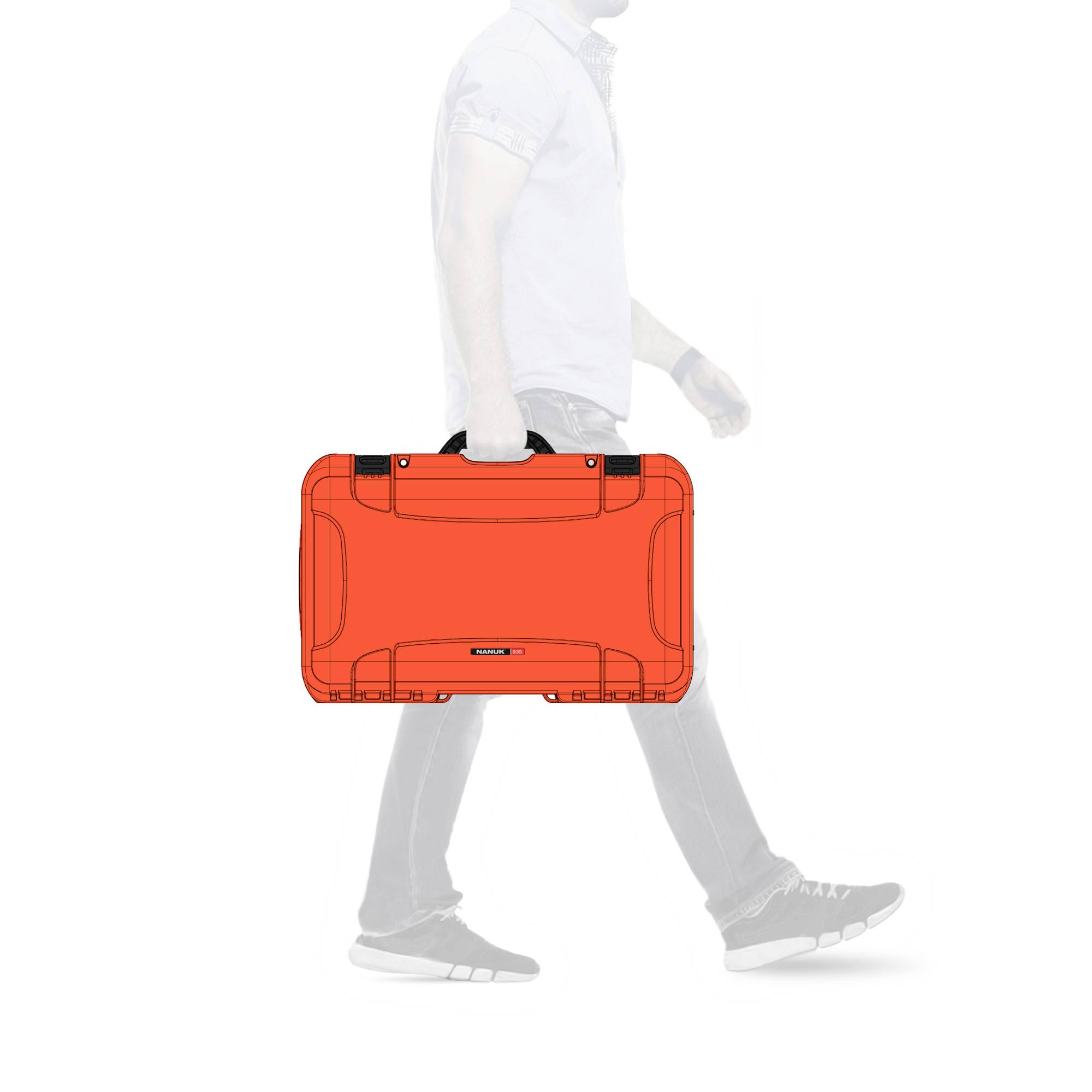 A person is carrying a striking orange suitcase while walking, with no visible surroundings or background.