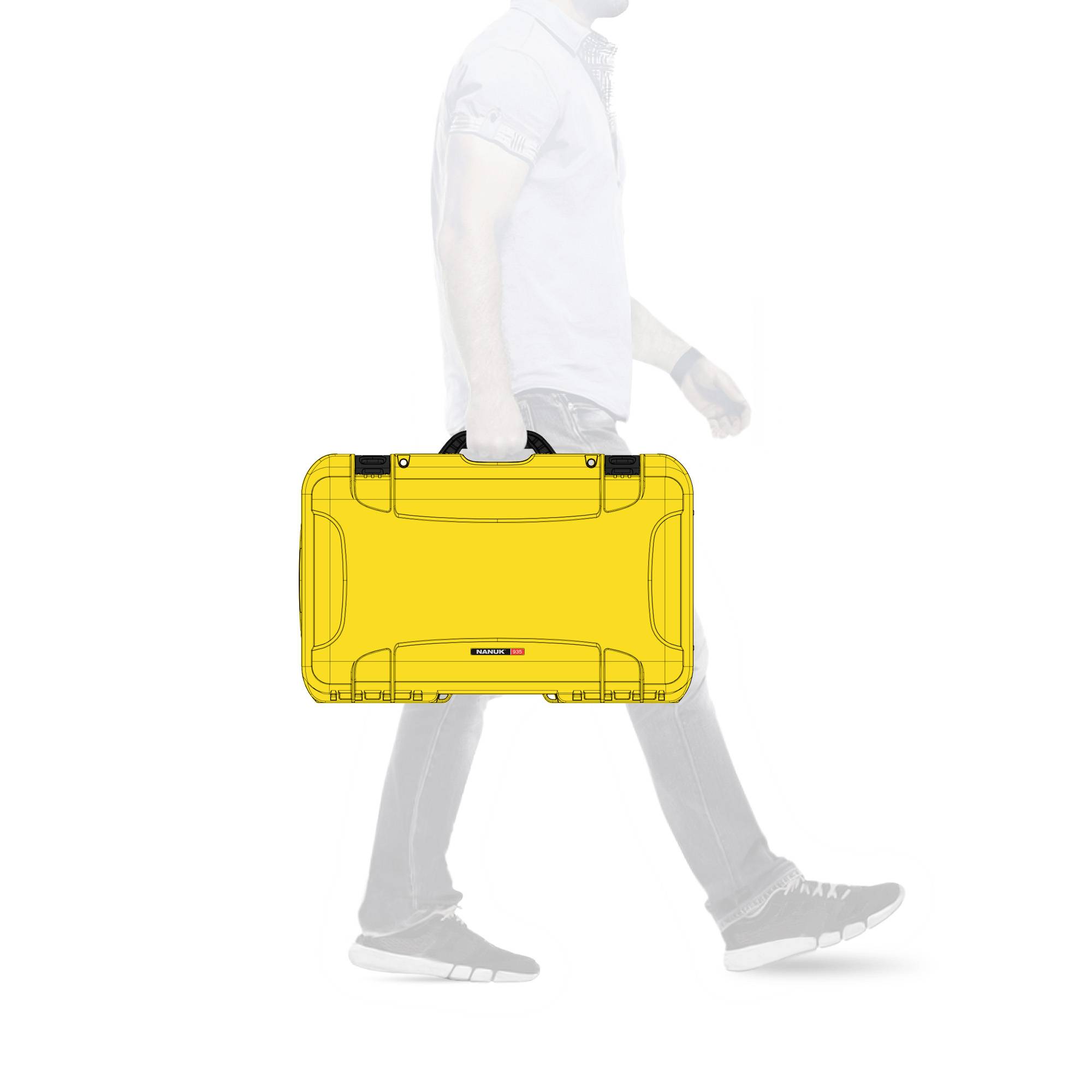 A person in business attire is walking to the right, carrying a yellow briefcase.