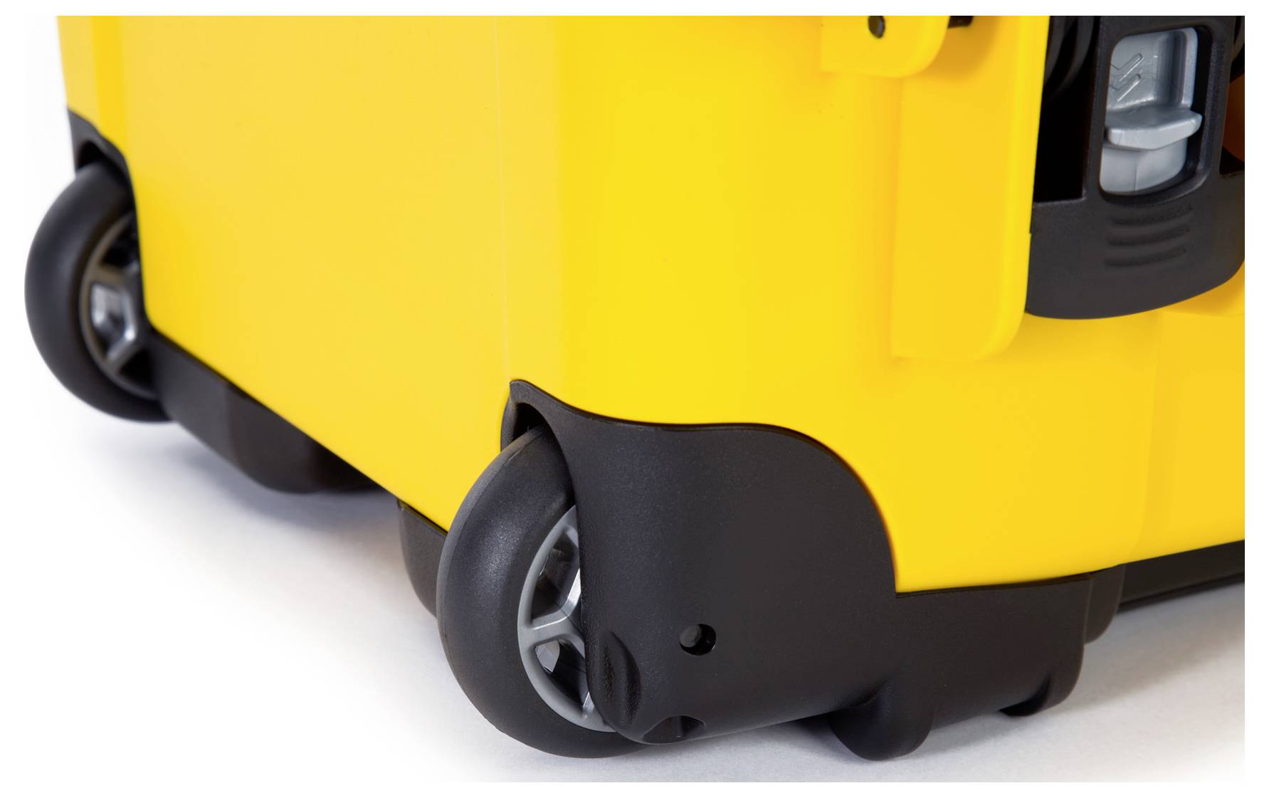 Yellow plastic container on wheels, close-up shot cutting off the top shows robust black wheels and details of the bottom corner.