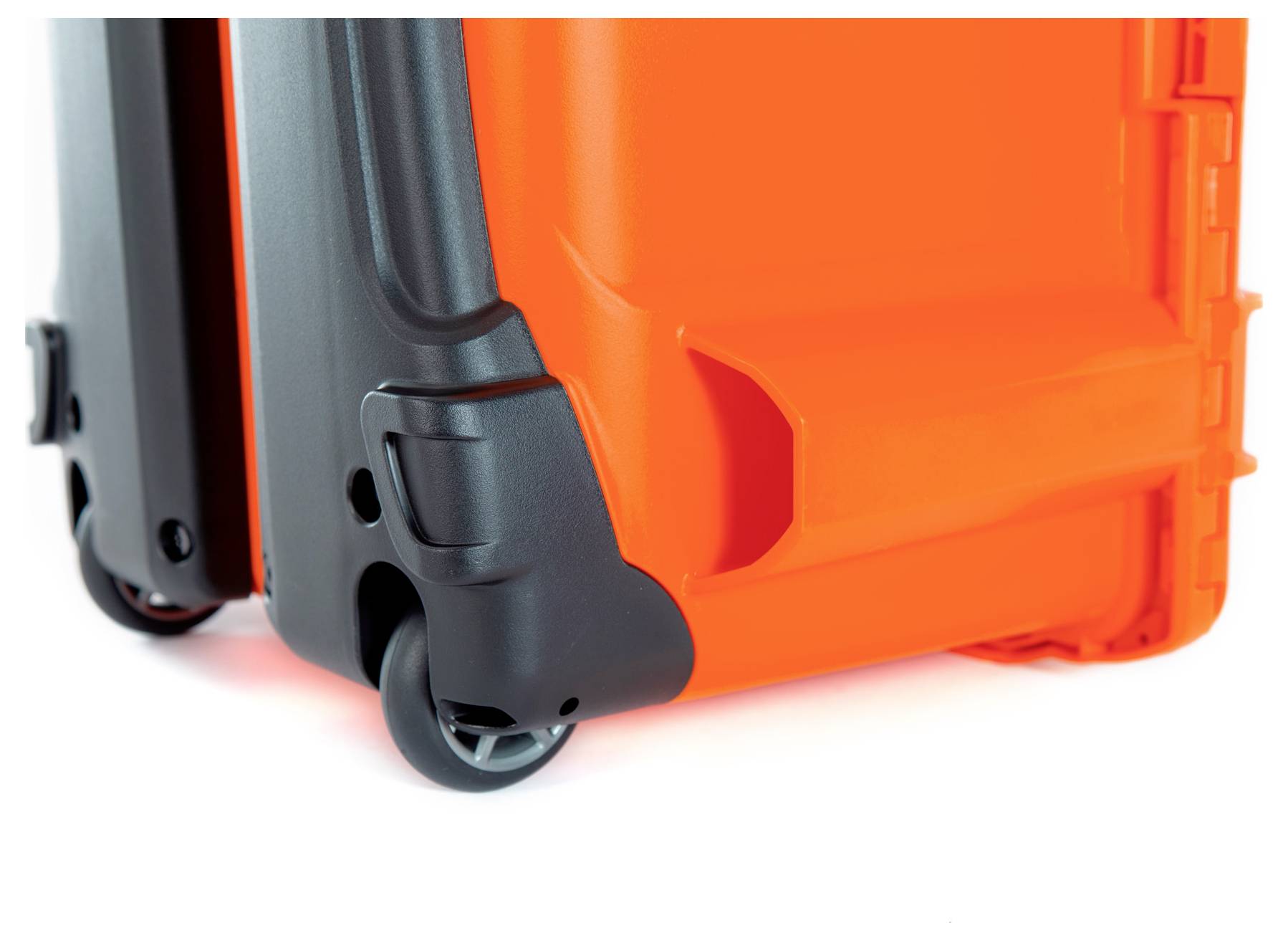 Part of an orange suitcase with black wheels, close-up of the underside and wheels, emphasising mobility and durability.