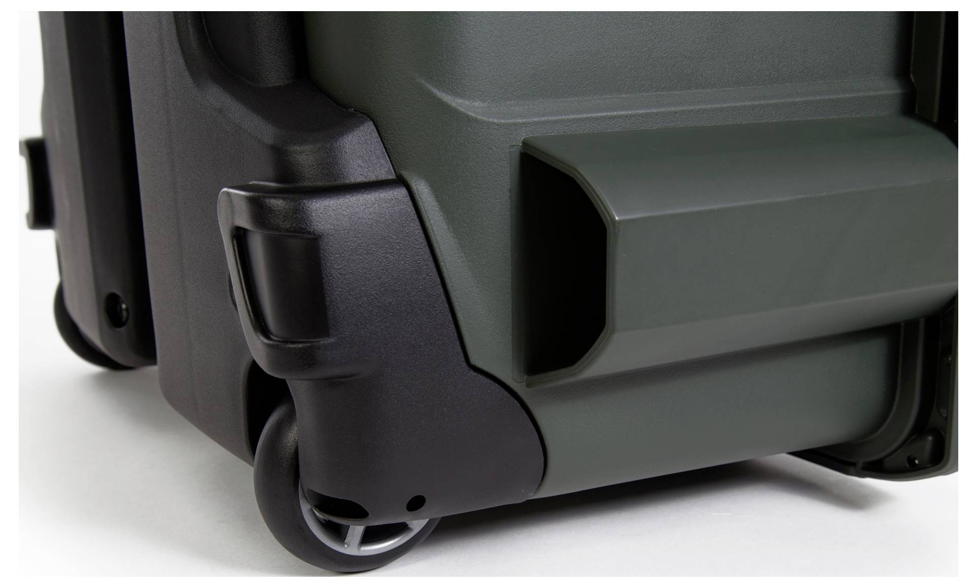 Close-up of a sturdy transport wheel on a robust plastic case. Clearly visible corners and wheels for mobility.