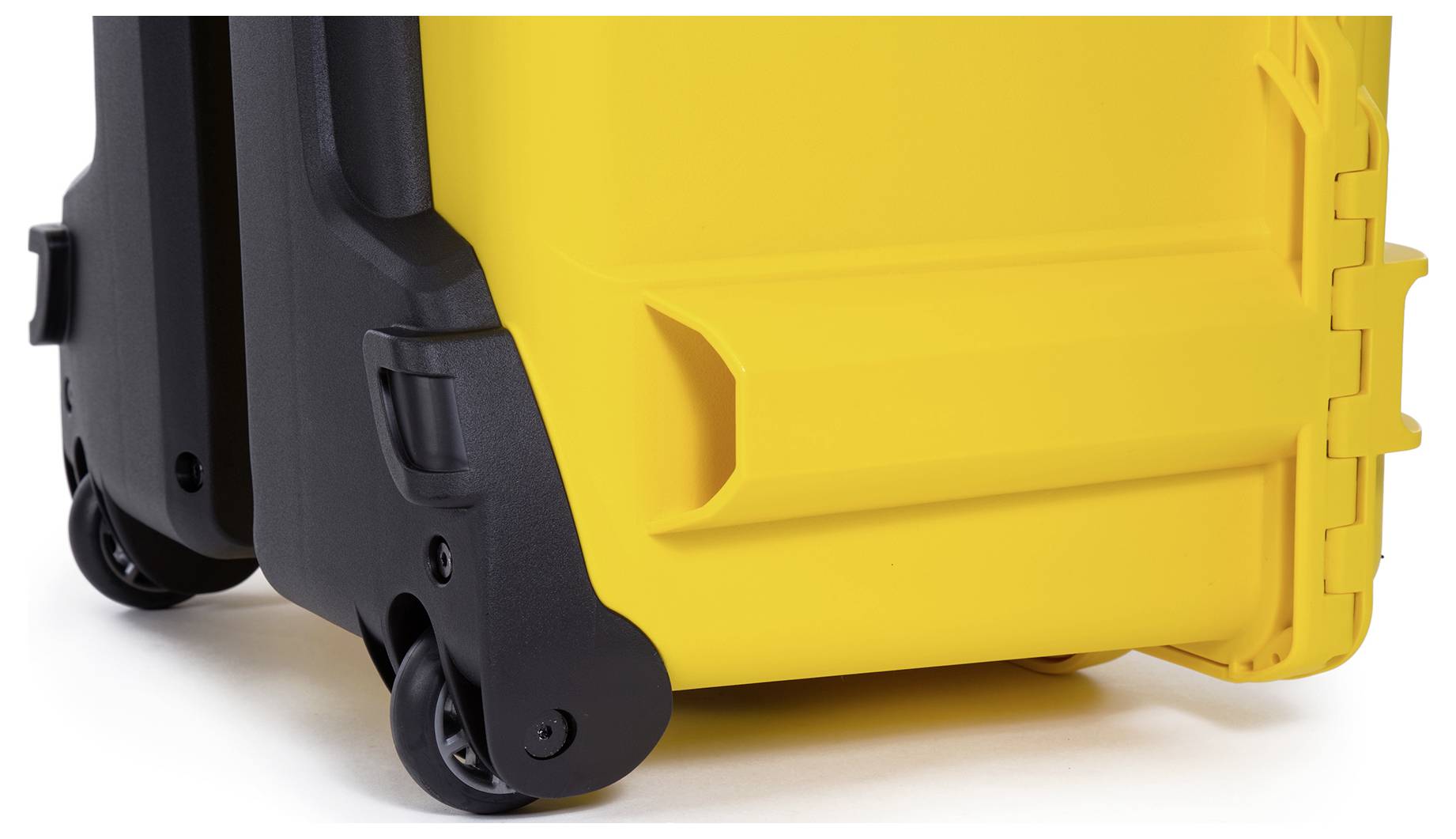 Yellow suitcase with black wheels on a white background. The construction is sturdy and shows details such as corners and handle.
