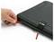 A hand opens a black Nanuk case with a grey texture and a red zipper slider.