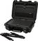 Opened black hard-shell suitcase with a mesh inner pocket. Detachable shoulder straps are lying beside it.