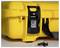 Yellow hard-shell suitcase with a black lock, with a key lying beside it. The suitcase appears to be securely locked.