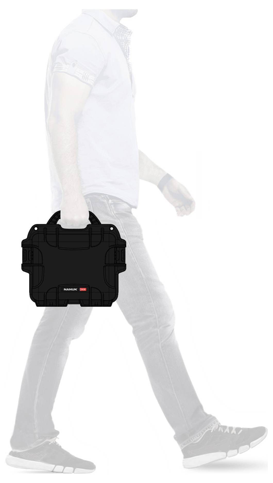 A person is carrying a black, square bag in their left hand. The person is in motion and wearing casual clothing.