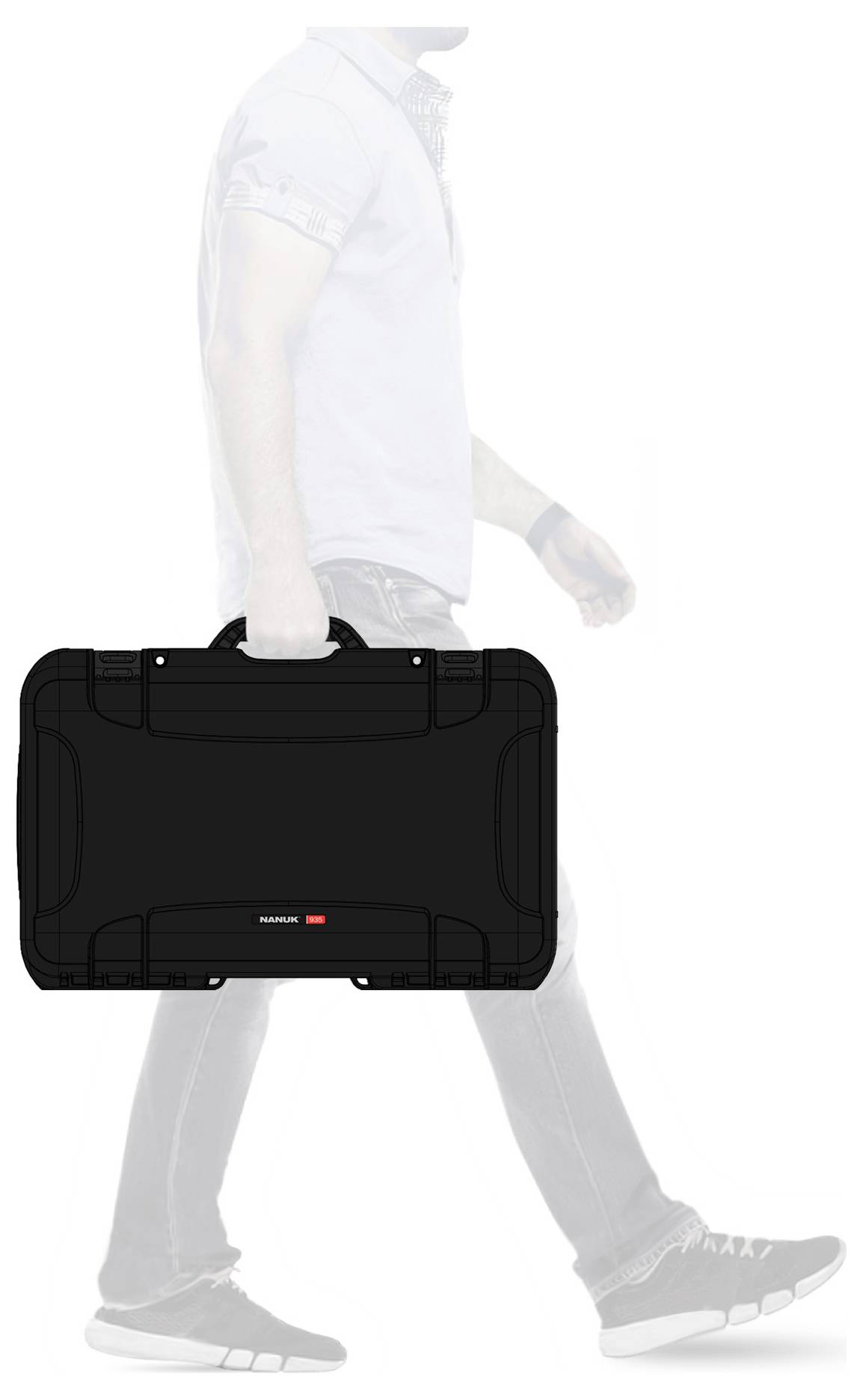 A person is carrying a black hard-shell suitcase in their right hand. The suitcase has a minimalist design and a handle on top.