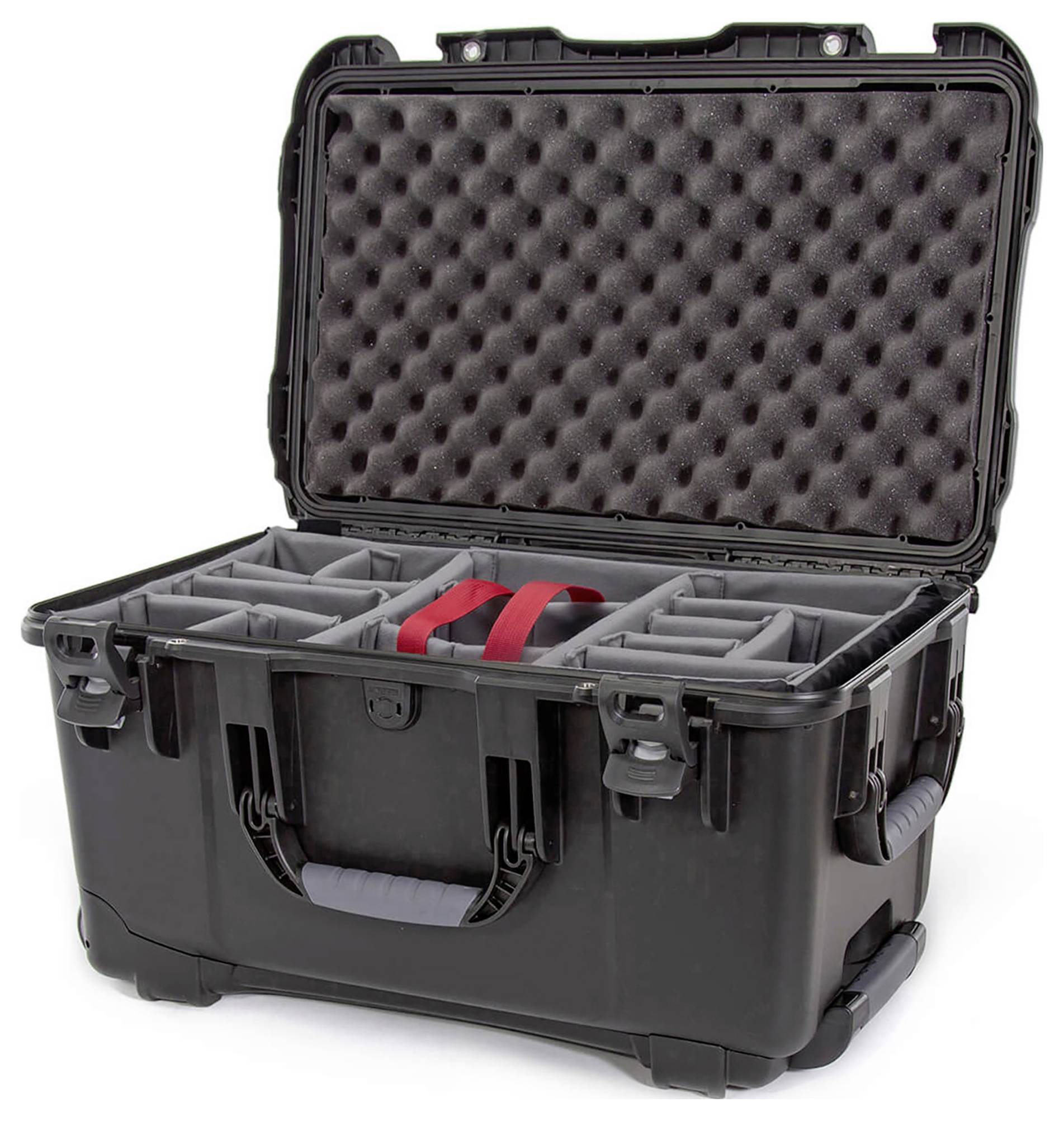 An open, black hard-shell case with foam padding inside. The case has several removable compartments and a red handle.