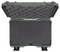 Open, empty green hard-shell suitcase with black foam lining.