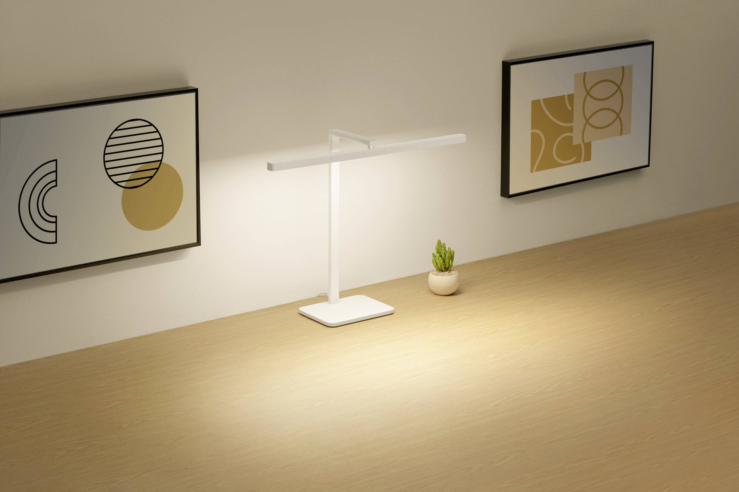 Bright table lamp on a wooden surface, illuminating an area. Abstract artworks on the walls to the left and right, with a small plant nearby.