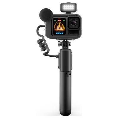 Compact action camera with display, microphone, LED light and grip. Ideal for outdoor videography and vlogs.