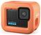 Orange GoPro camera with black front lens and blue text. Compact, waterproof design. Ideal for outdoor adventures.