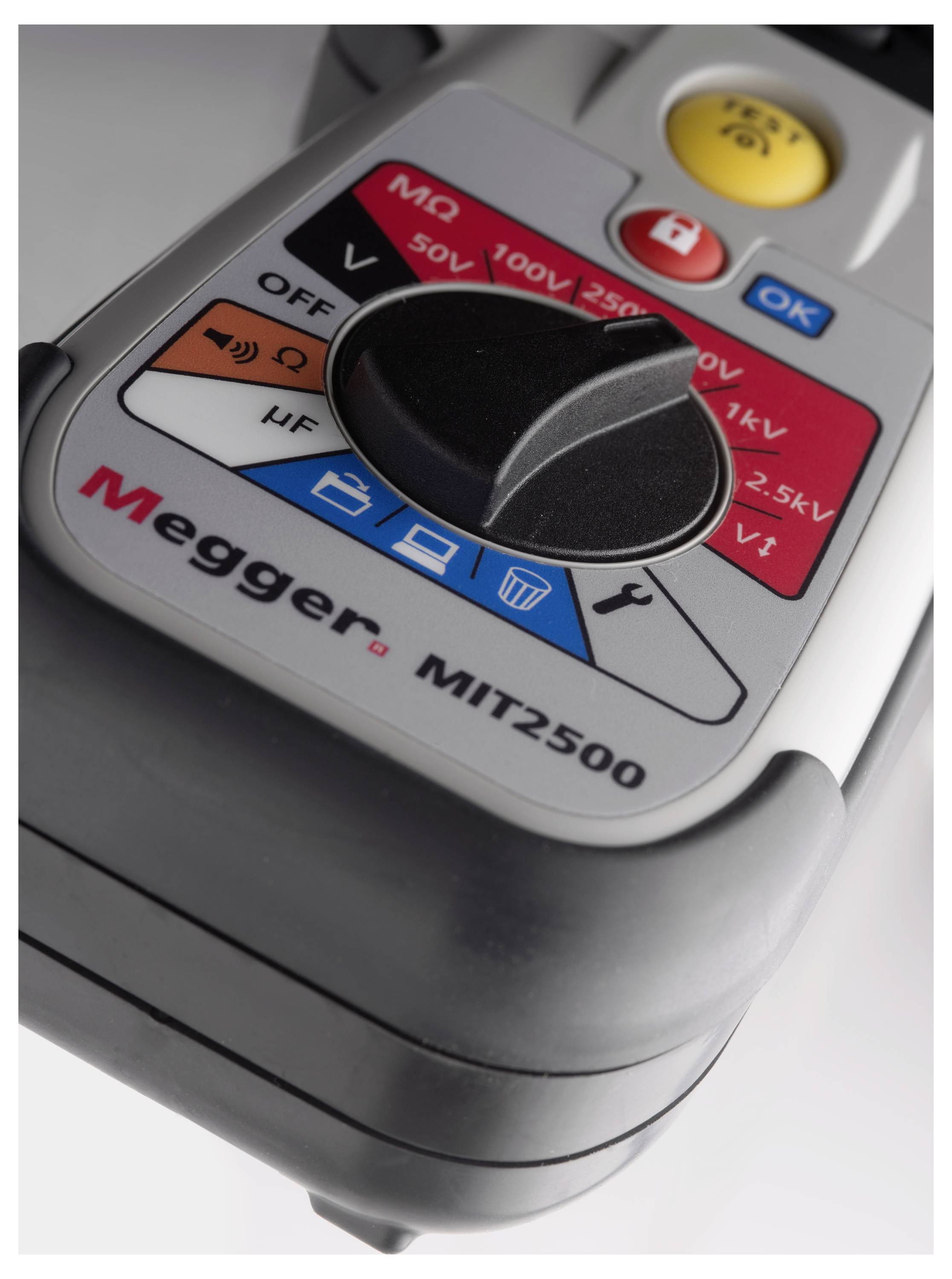 A Megger MIT2500 insulation resistance measuring device with voltage selection switches and function key indicators.