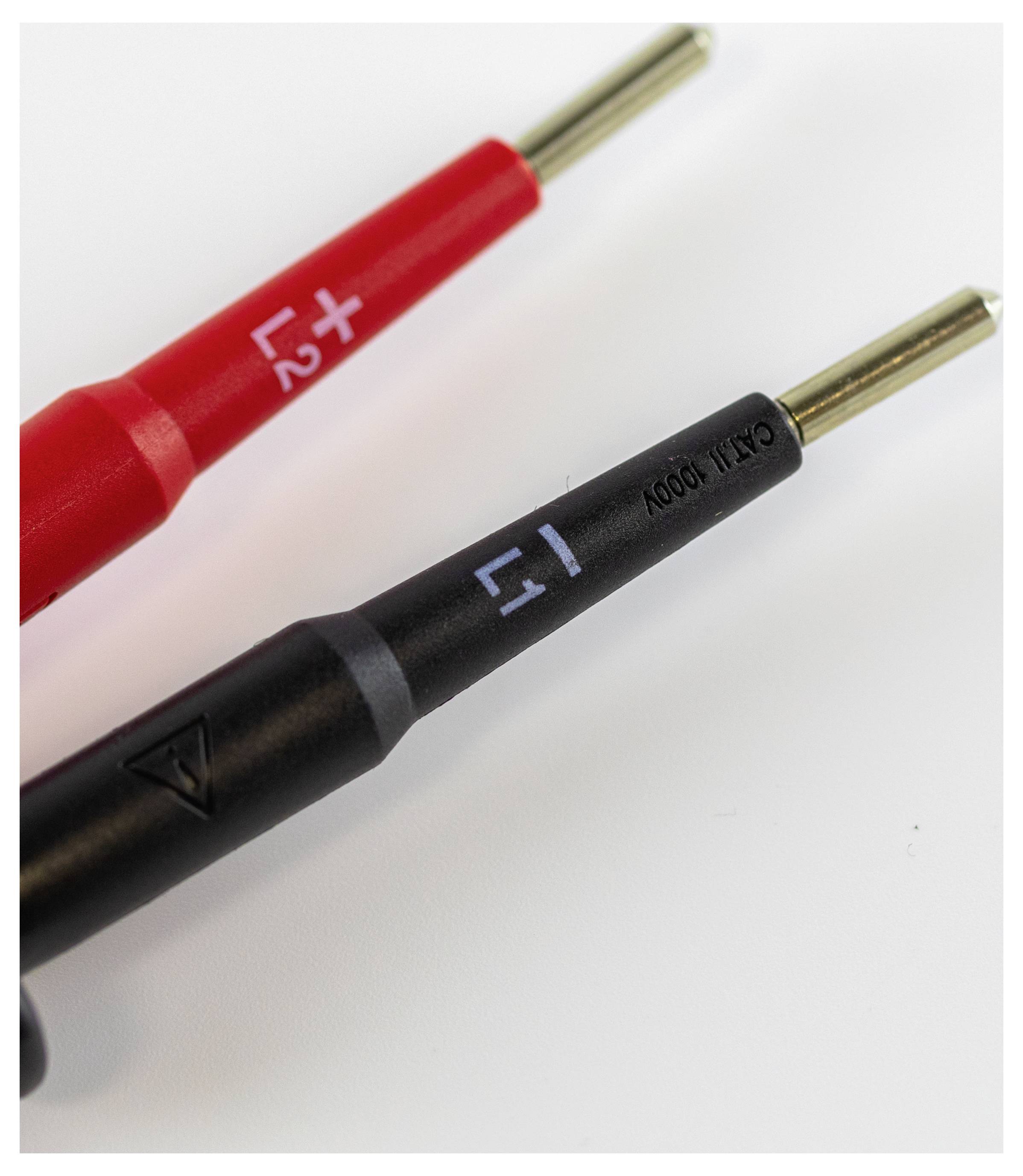Two test probes, one red with '+' and one black with '-', on a white background. They are intended for electrical measurements.