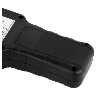 Close-up of a black handheld electronic device or tool casing with textured grip, rounded end, screw holes, and partial label visible.