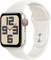 A smartwatch with a large dial that displays large numbers and hands. It has a white strap and a silver case.