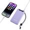 Smartphone and purple power bank are connected via a cable; smartphone displays apps, power bank shows charging status.