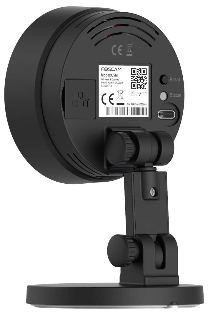 Rear view of a black surveillance camera on a table stand, showing the brand logo and model code on a label.
