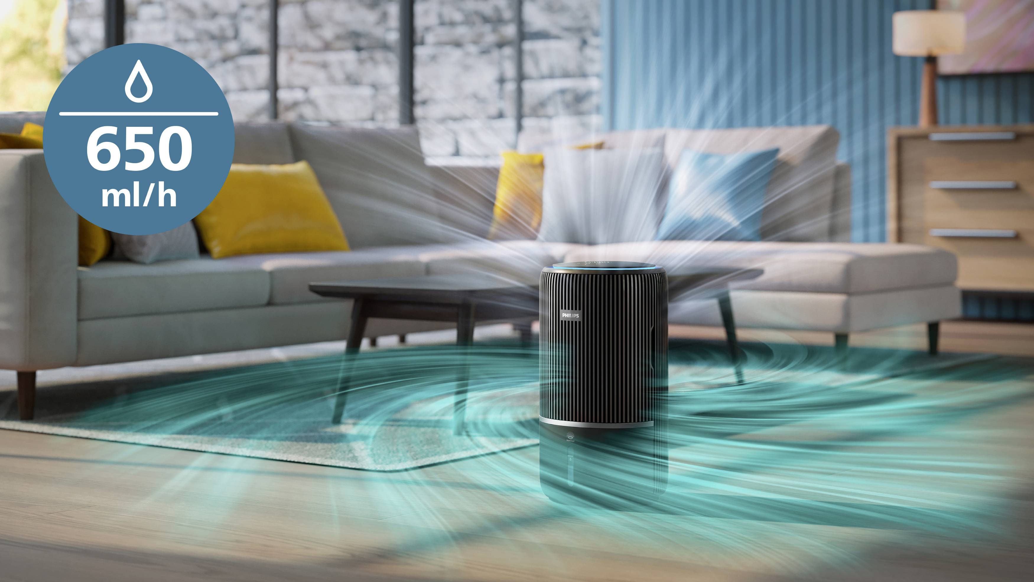Air humidifier in a modern living room. Display showing: '650 ml/h'. Water jet animation surrounding the device. Sofa and cushions in the background.