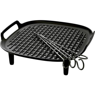 A black griddle with a grid pattern and three metal skewers on it. The plate has short legs and a handle.