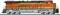 Orange-yellow freight locomotive with 'BNSF' written on the side. Locomotive is standing on a track.
