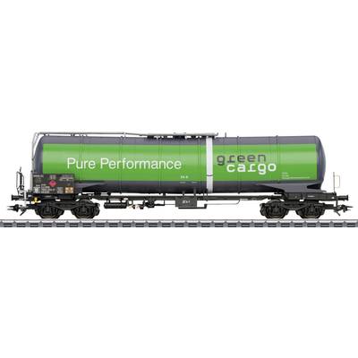 'Green freight train with the inscription "Pure Performance green cargo" on a track, focused on environmental friendliness in transport.'