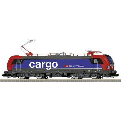 A modern red and blue electric locomotive of SBB CFF FFS Cargo is standing on the track, with 'cargo' written on its side.