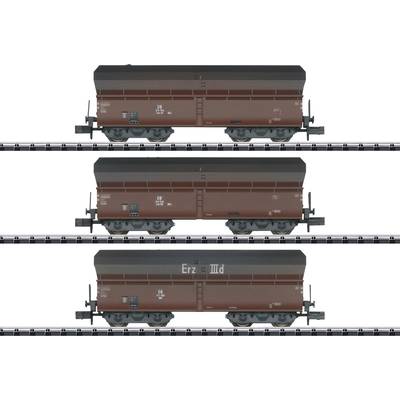 Three identical brown goods wagons on railway tracks, each with the inscription 'Erz III d', side view.