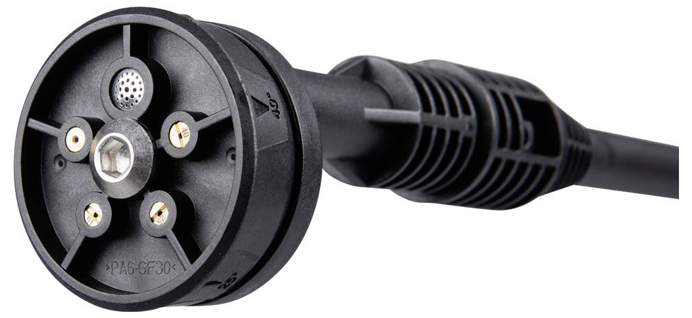 A black, cylindrical plug with circular connectors and cable. Likely used for technical devices or charging units.