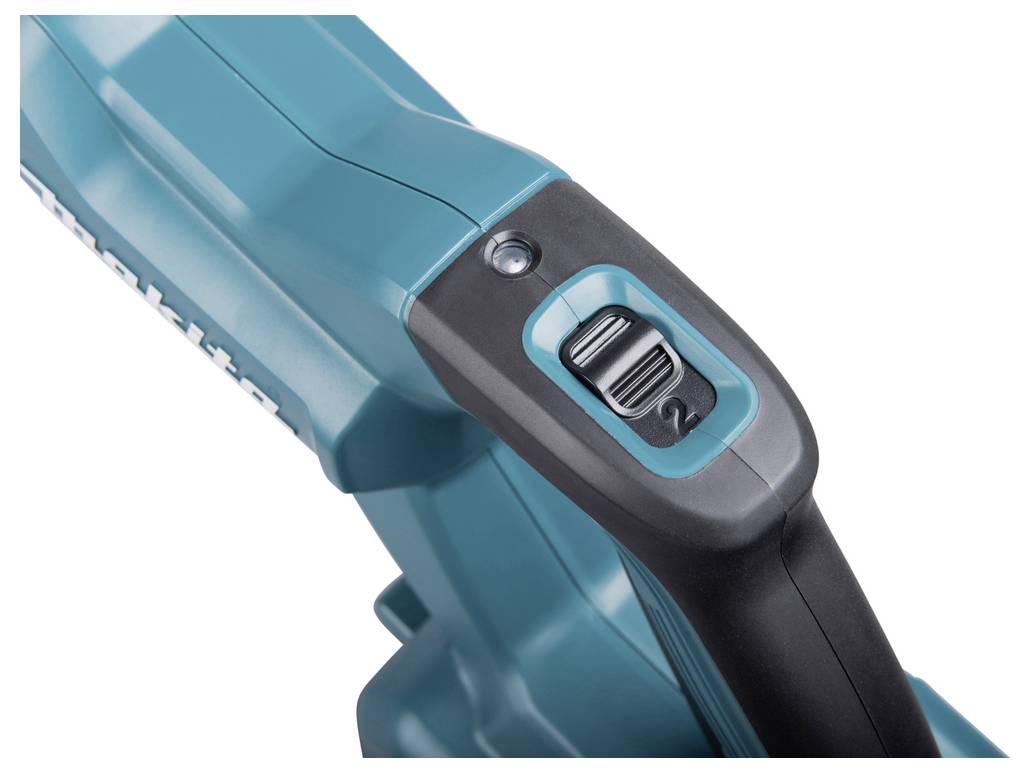 Close-up of a turquoise electric power tool with a black handle and a switch on top.