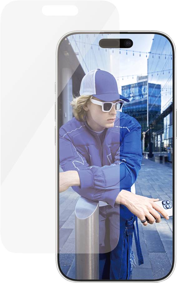 A person leans back relaxedly against a bollard in an urban environment. They are wearing glasses and a baseball cap.