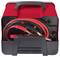 Red battery charger with cables and clamps in storage. Suitable for 220V-240V mains voltage.