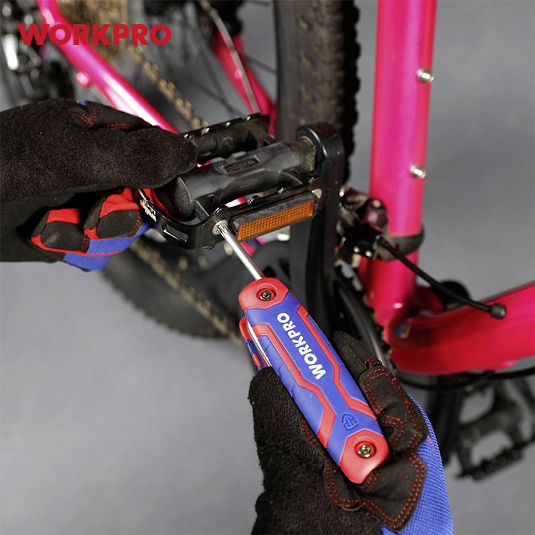 A person is assembling a bicycle pedal with a screwdriver. The background shows part of a pink bicycle.