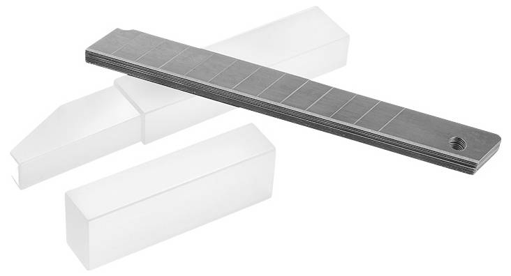 Rectangular, grey metal strips with printed squares, lying across two white, rectangular blocks.
