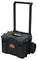 Black rolling suitcase with extendable handle and large side wheels. On the front, it reads 'ROC Pro Gear System'.