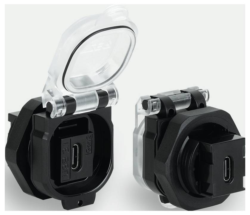 Two black USB-C ports with transparent protective covers, one open and one closed, on a grey background.