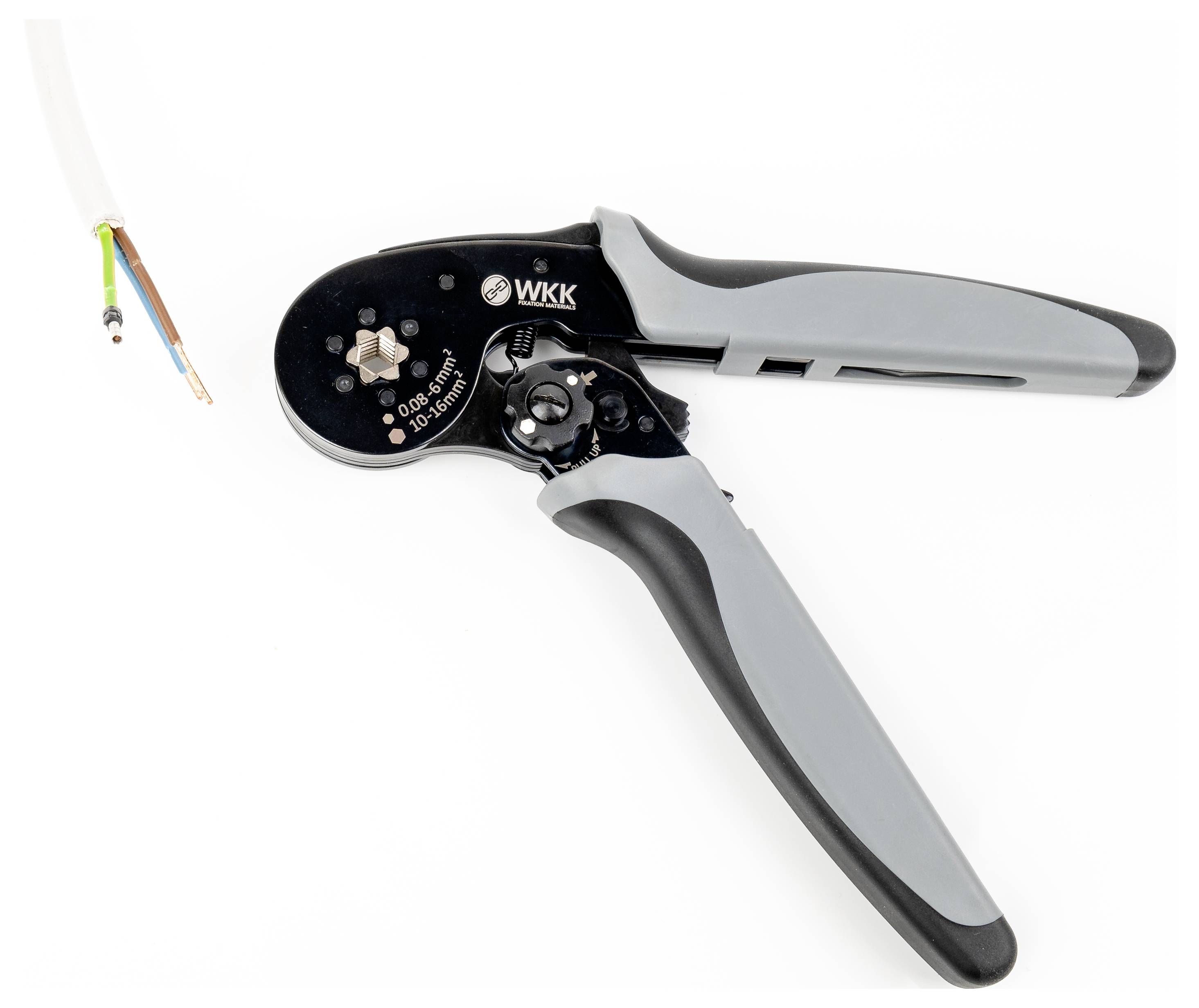 Wire strippers and a cut cable with coloured wires, ready for use in electrical work; tools in the foreground.