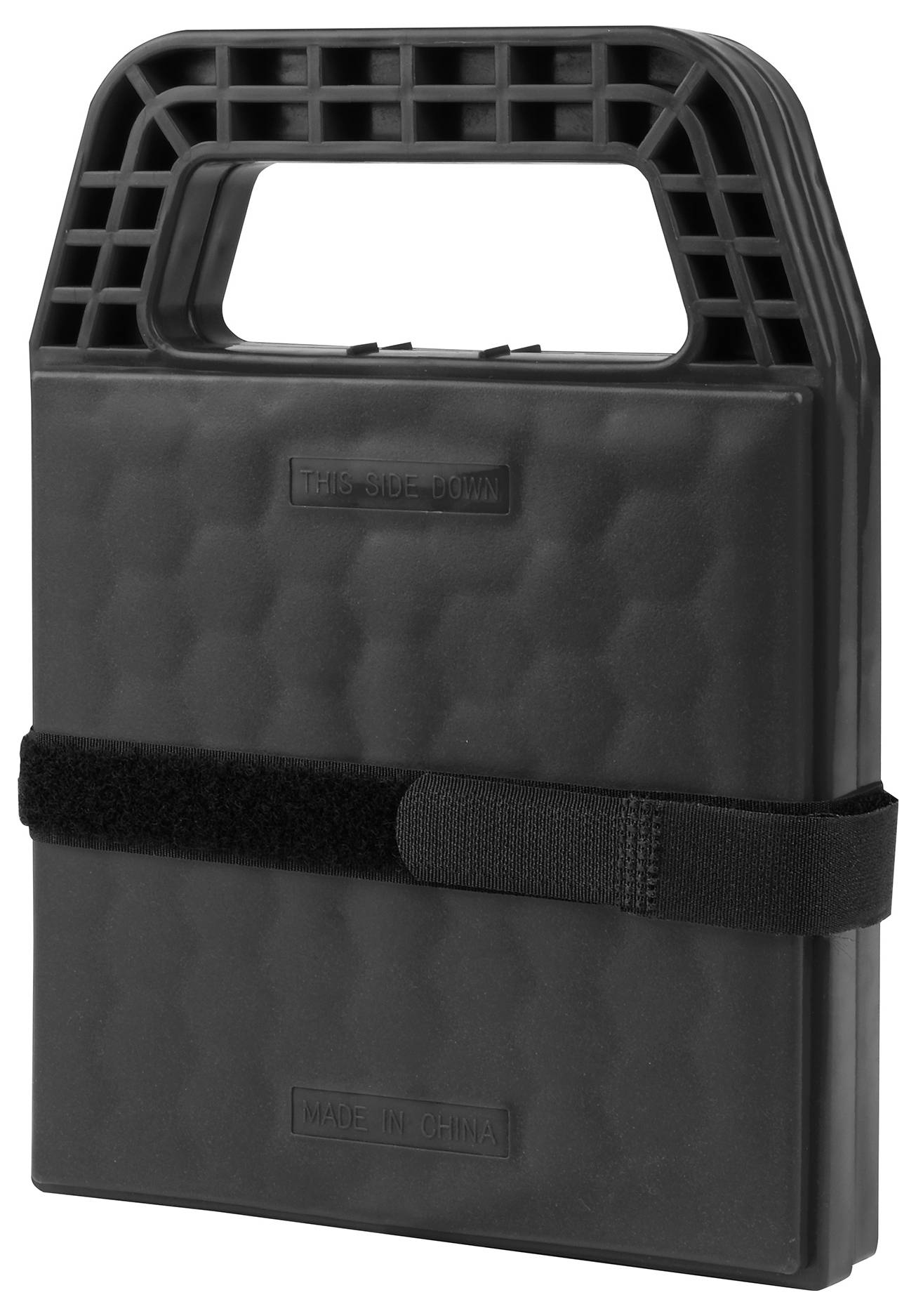 Black, rectangular plastic item with a handle and hook-and-loop fastener, possibly a portable seat cushion or supportive surface.