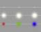 Coloured light points on a grey background, white at the top, then red, green, blue.