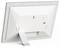 A digital photo frame in silver with a stand, rear view. Shows mounting points and speaker openings.