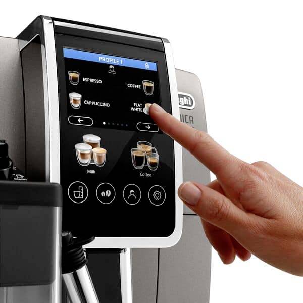 A hand operates a modern coffee machine display. Various coffee specialities such as espresso and cappuccino are selectable.