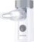 A portable white and silver inhaler. The mouthpiece and power switch are visible. Brand name 'Sanitas' on the device.