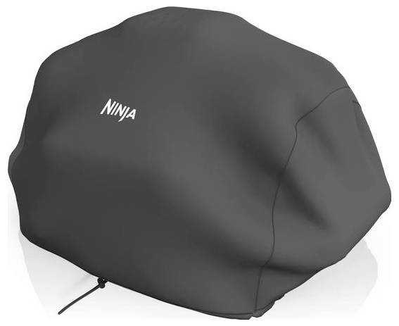 Black cover with the inscription 'Ninja' conceals a large object, presumably a barbecue.