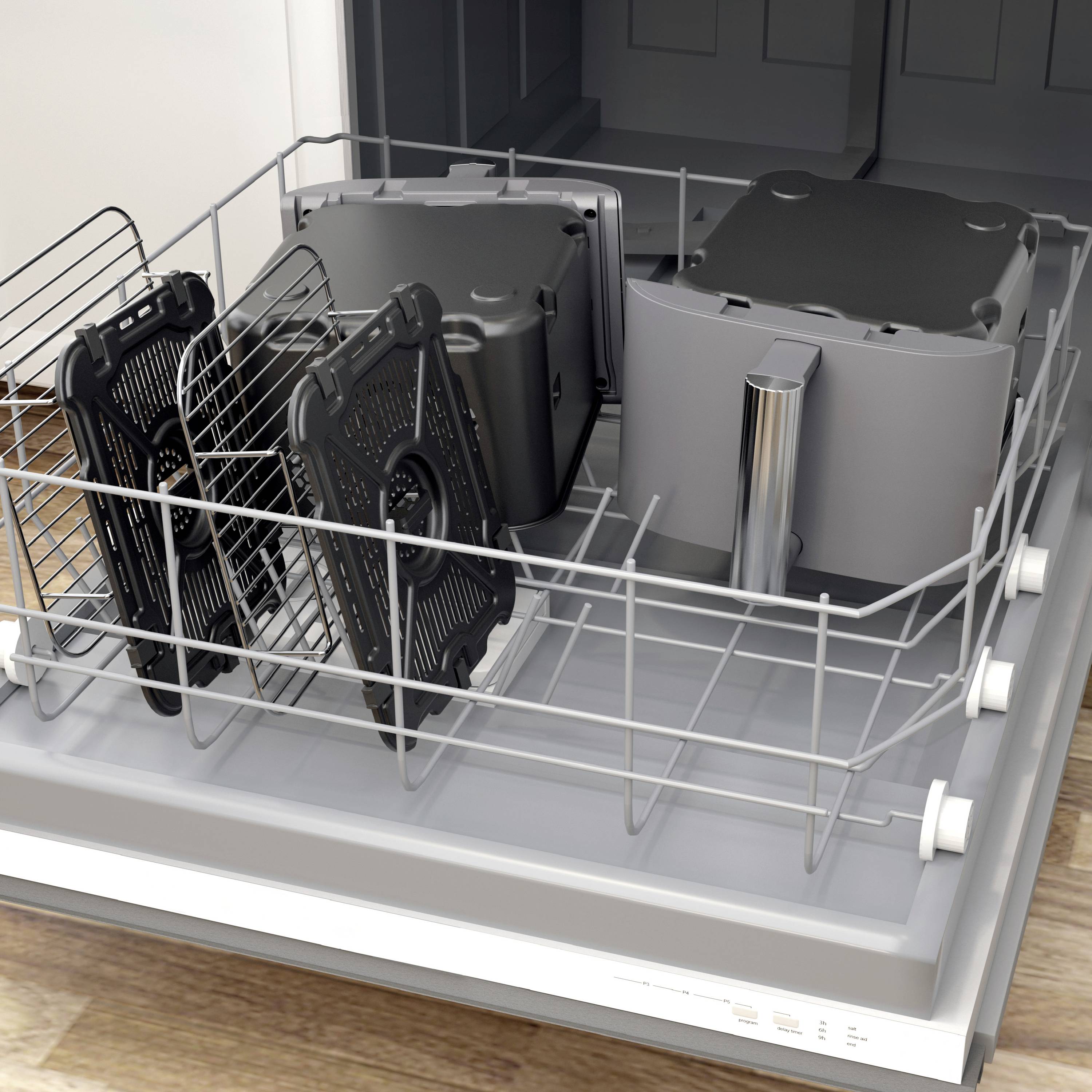 A dishwasher with several black computer components in the racks. Parts are lying in the traditional plate spaces.