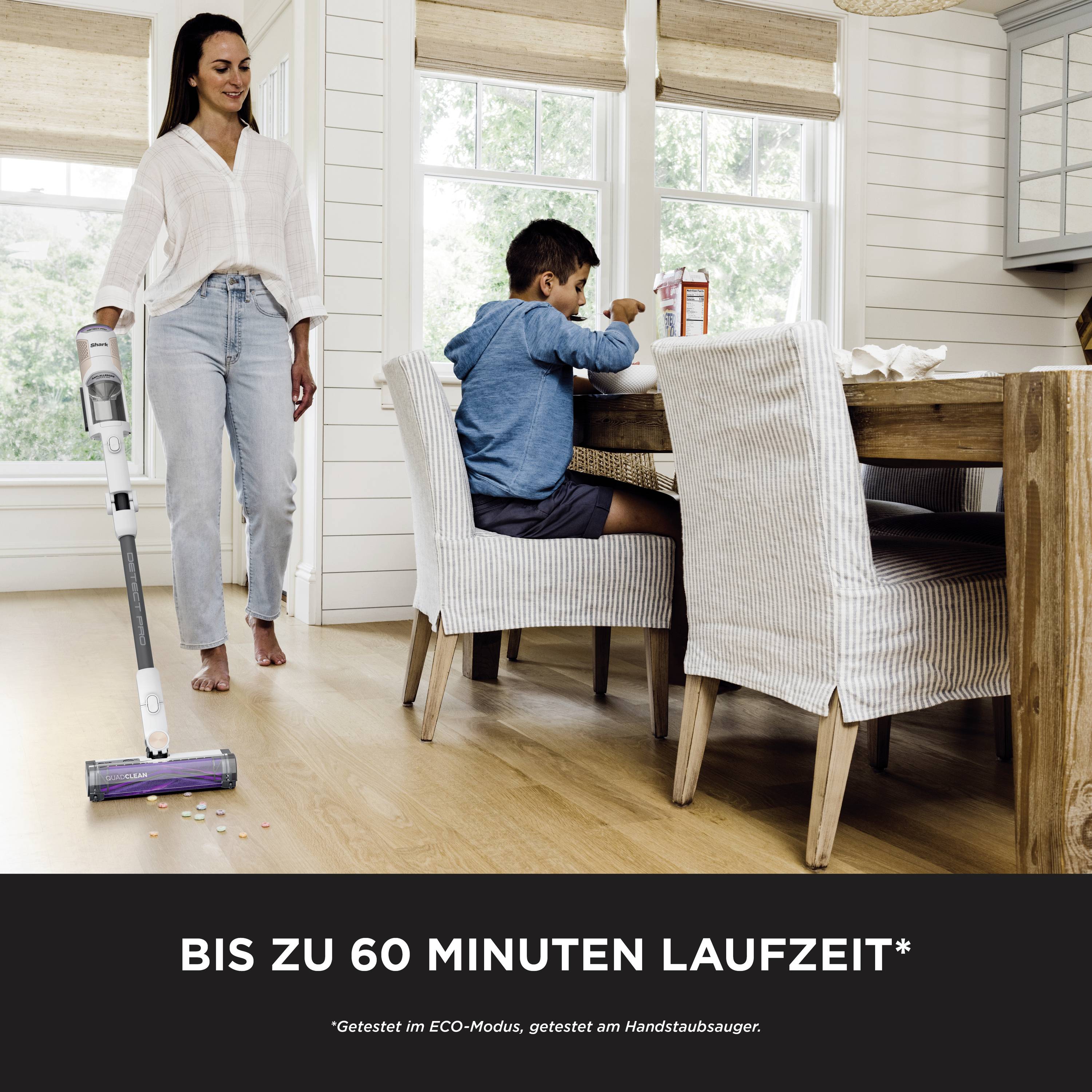 A woman is hoovering a wooden floor next to a child sitting at a table. Text underneath: 'Up to 60 minutes runtime*'.