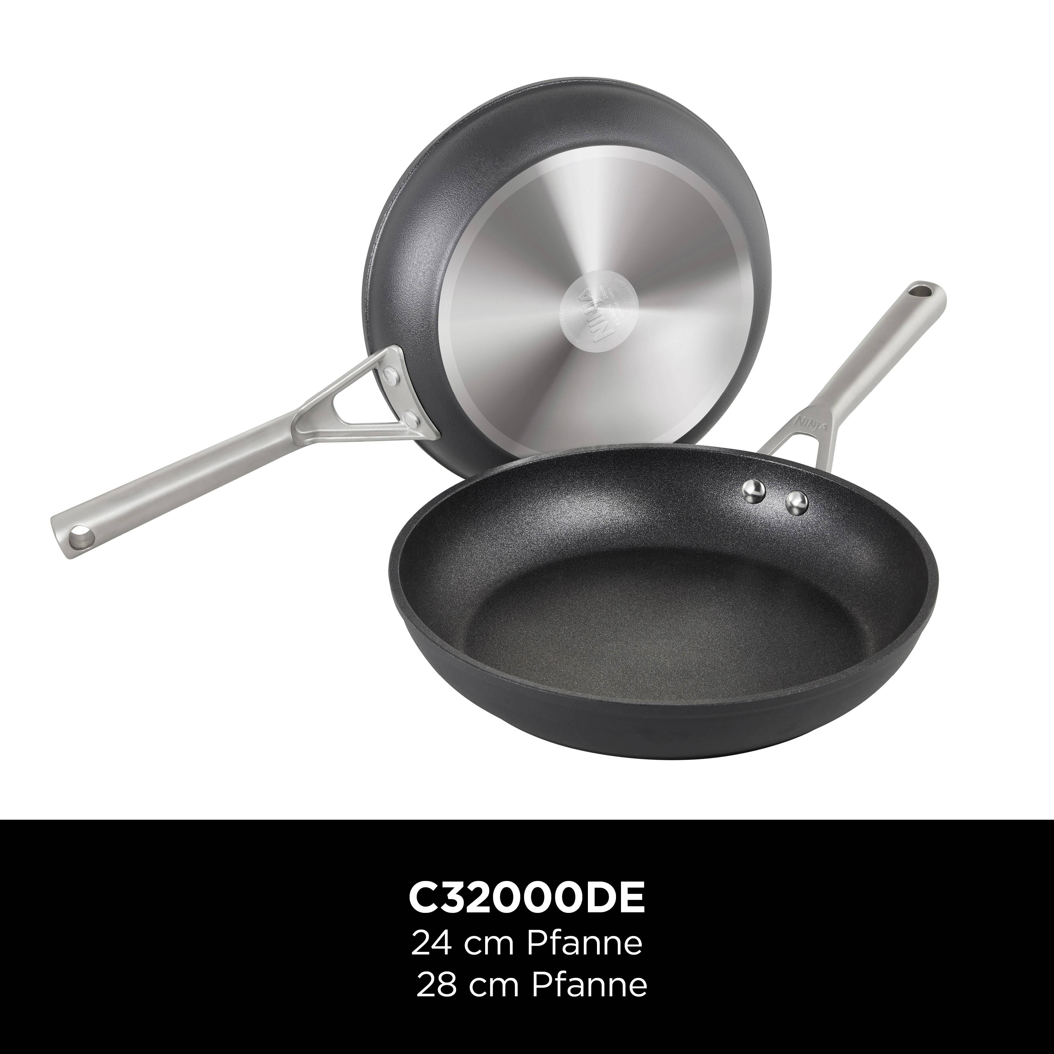 Two black frying pans with silver handles; one is positioned horizontally, the other shows its underside. Below it reads 'C32000DE, 24 cm pan, 28 cm pan'.