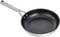 A black frying pan with a silver handle, isolated on a white background.